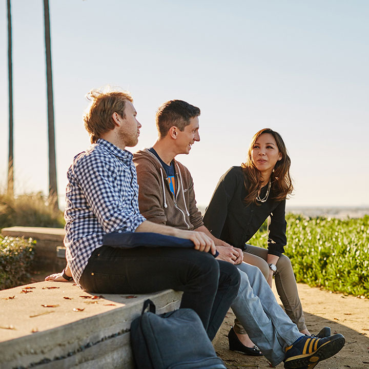 Students sitting on a bench overlooking the bluff